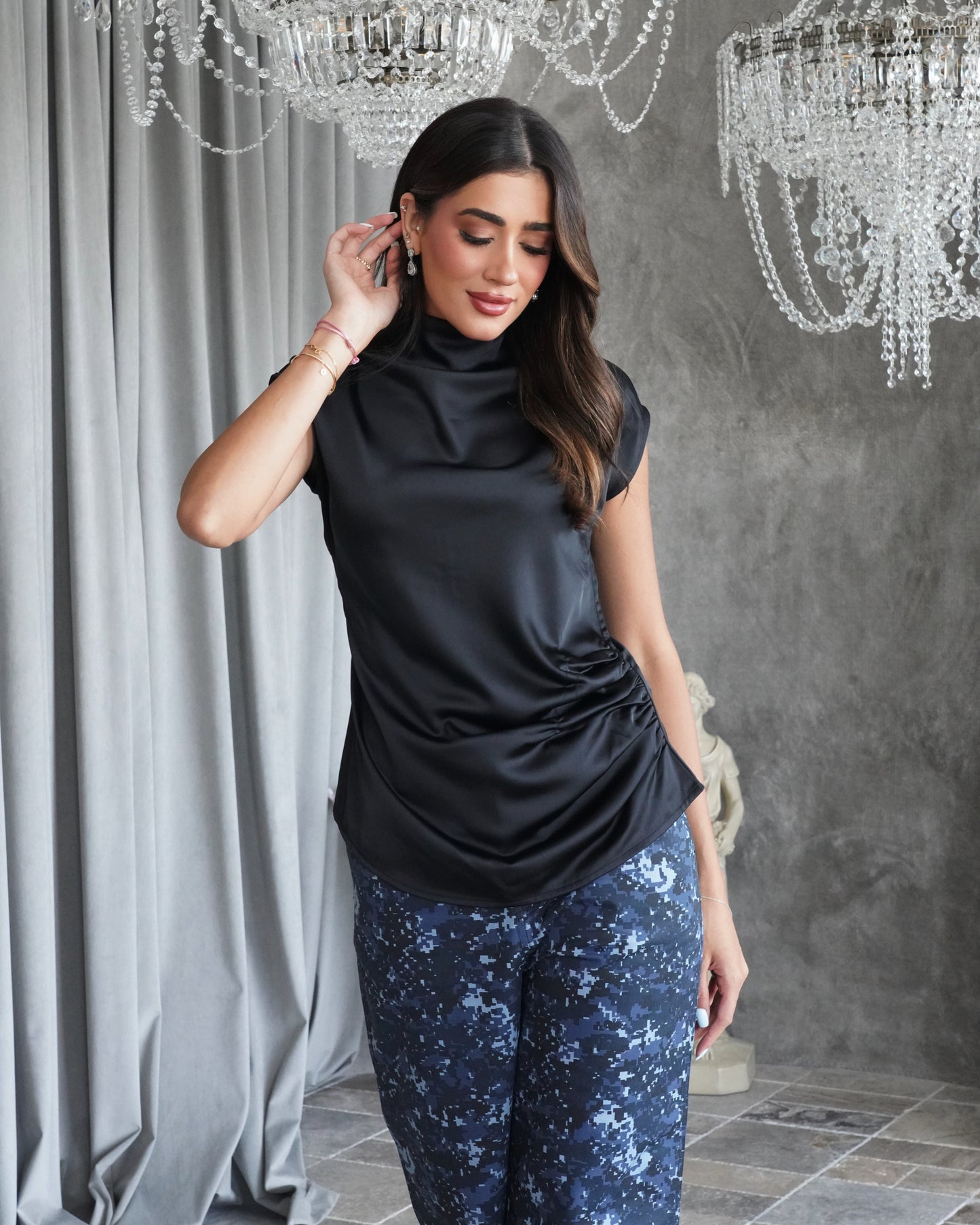 Black silk shirt with army print pants