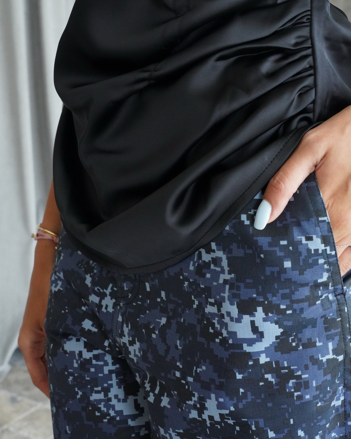 Black silk shirt with army print pants